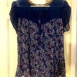 Super cute flowered short sleeve blouse.